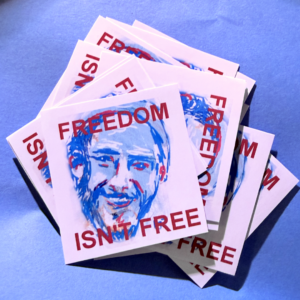 a pile of Alex Pretti art stickers