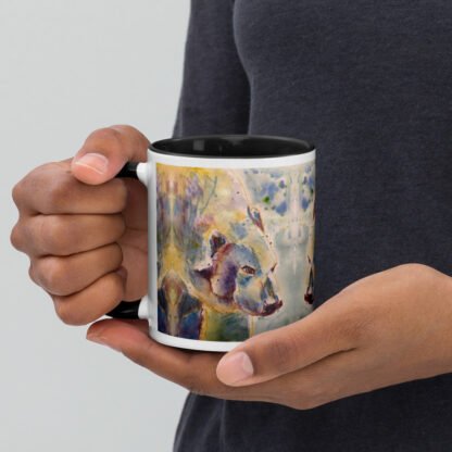 person holding mug with polar bear in their hands.